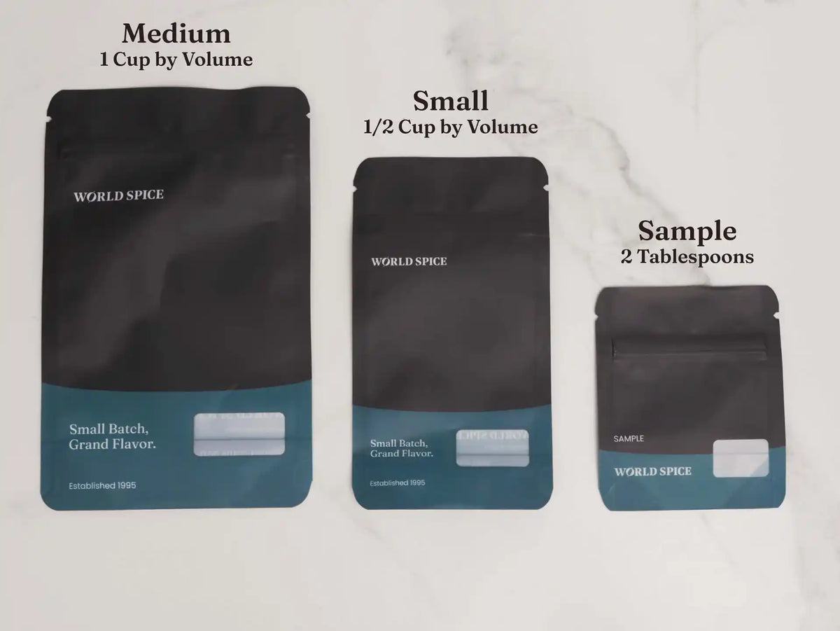 World Spice Fennel Seed packaging in medium, small, and sample sizes on a white marble surface.