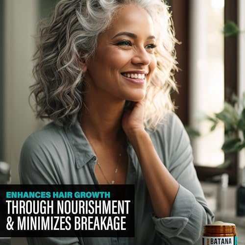 Smiling woman with curly gray hair showcasing the results of Hotana Batana Oil.
