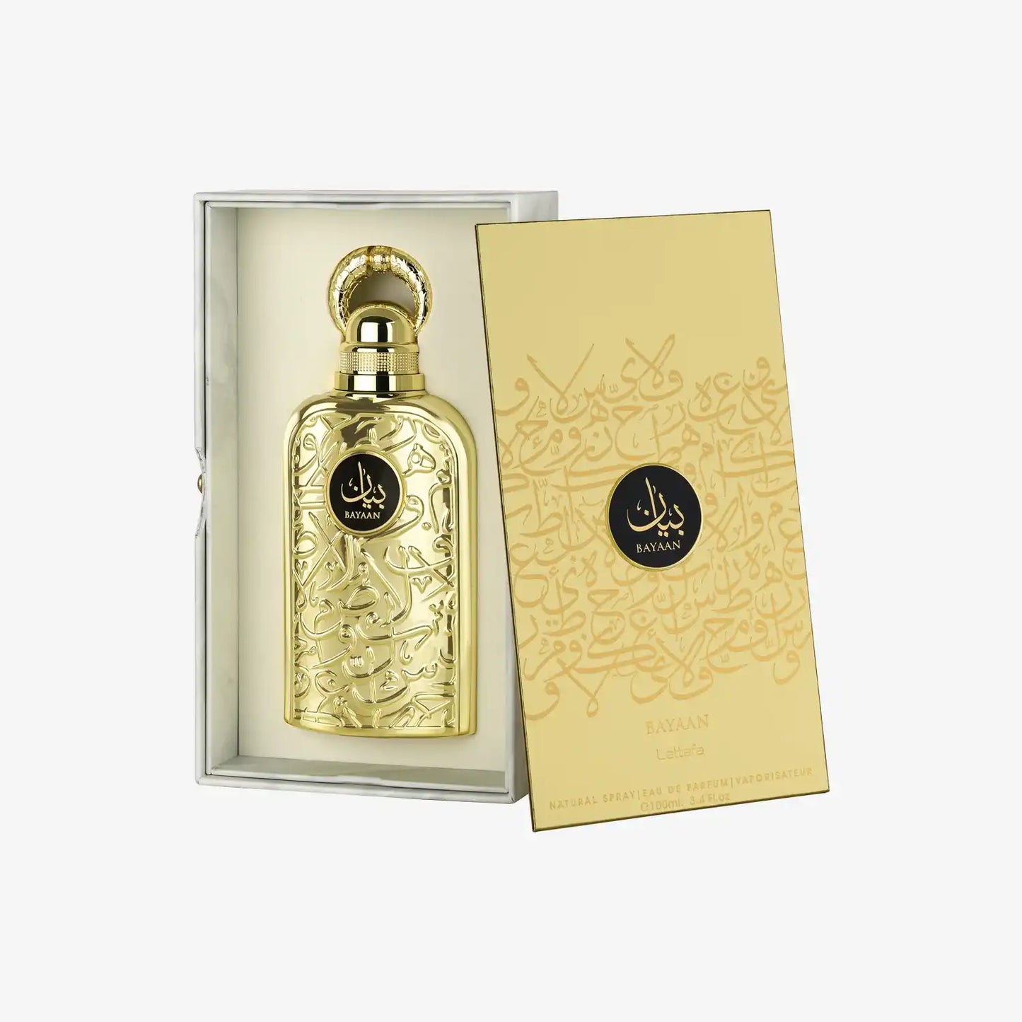 Gold perfume bottle with intricate Arabic calligraphy and matching decorative box