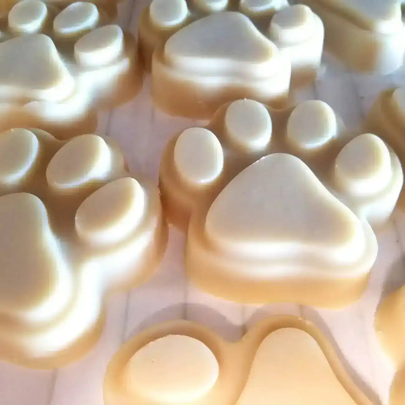 Paw-shaped soaps with creamy texture, ideal for pet lovers and natural skincare routines.