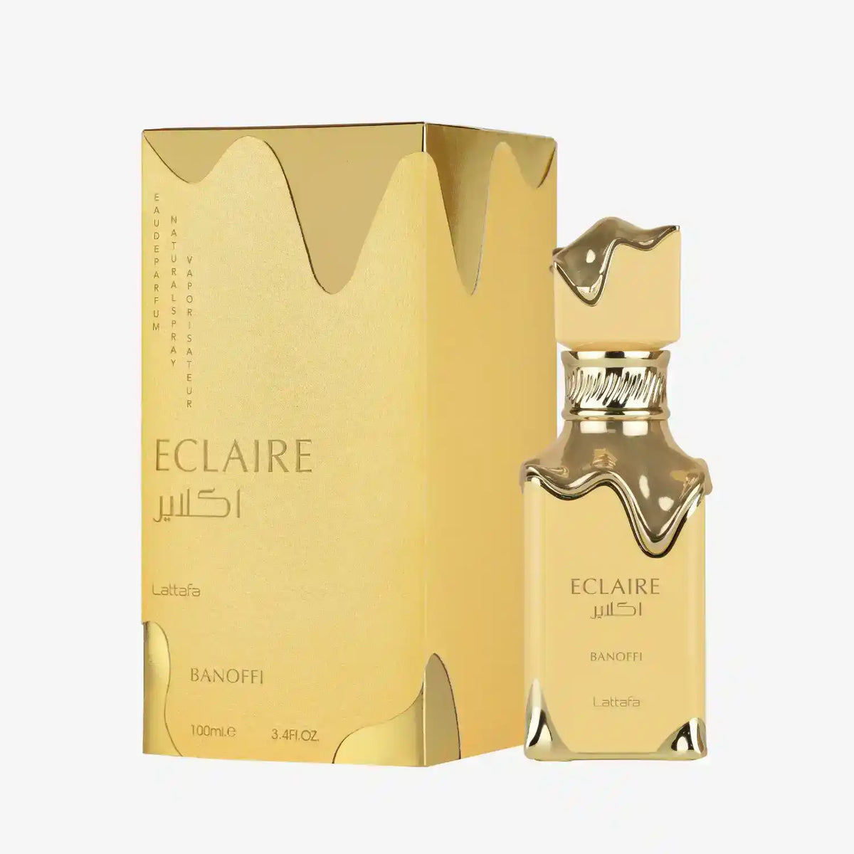Lattafa Eclaire Banoffi perfume bottle and gold packaging with flowing design accents