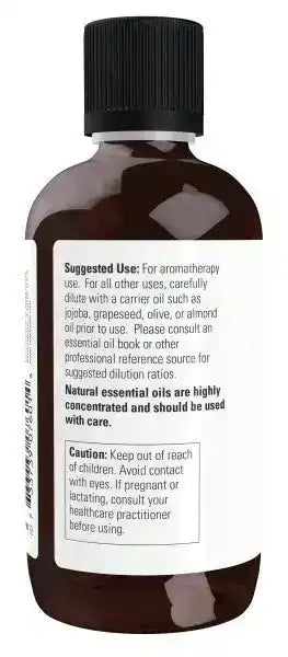 Brown bottle of rosemary essential oil with black cap and usage instructions on label
