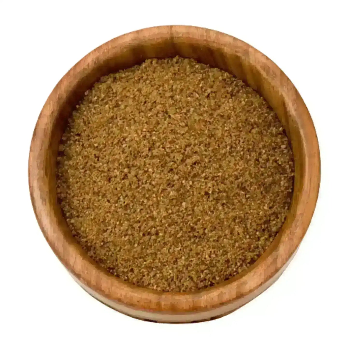 Ground Middle Eastern spices in a wooden bowl, authentic and finely blended seasoning