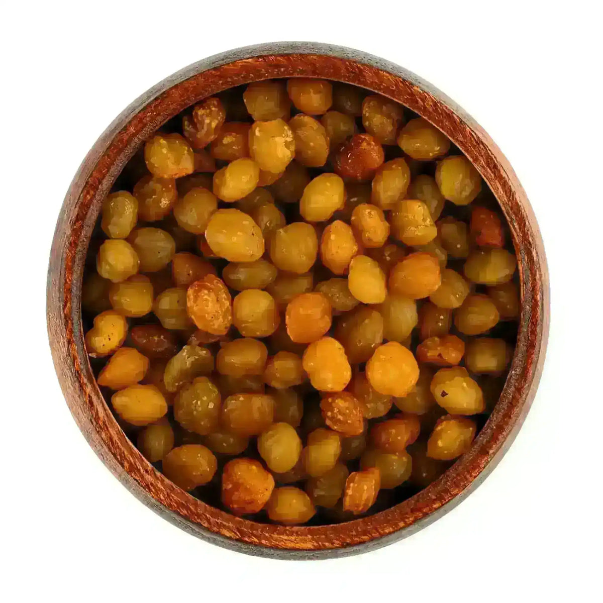 Raw pure African akpi seeds in a wooden bowl on a white background