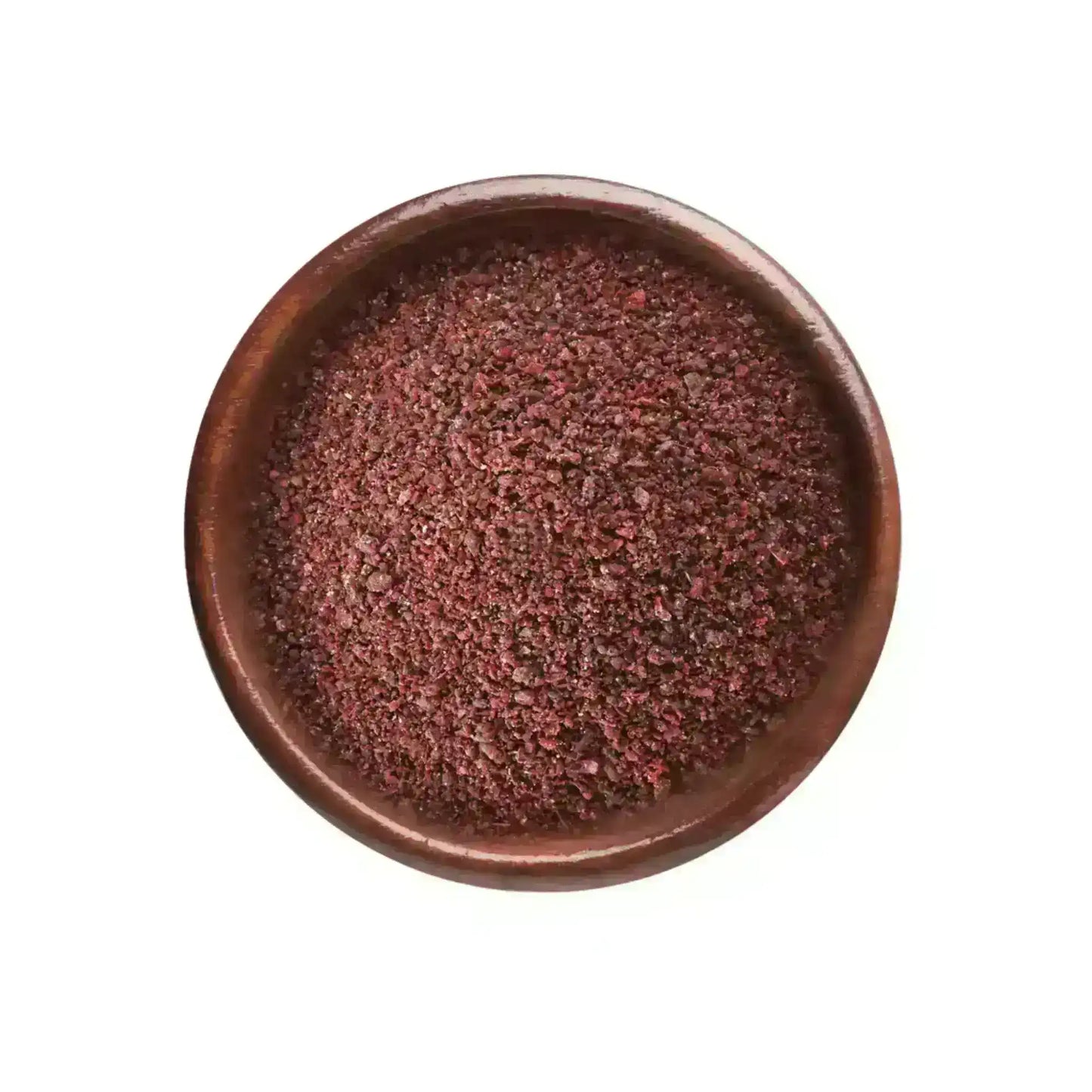 Ground sumac spice in a wooden bowl on a white background