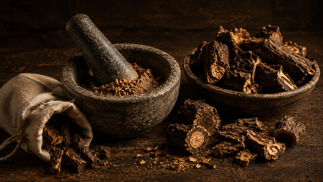 Coarse dried Indian costus root pieces in a rustic bowl with a stone mortar holding freshly ground powder and a linen pouch