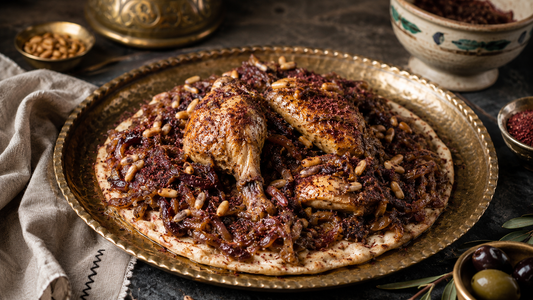 Musakhan — roast chicken over flatbread with sumac onions and toasted pine nuts.