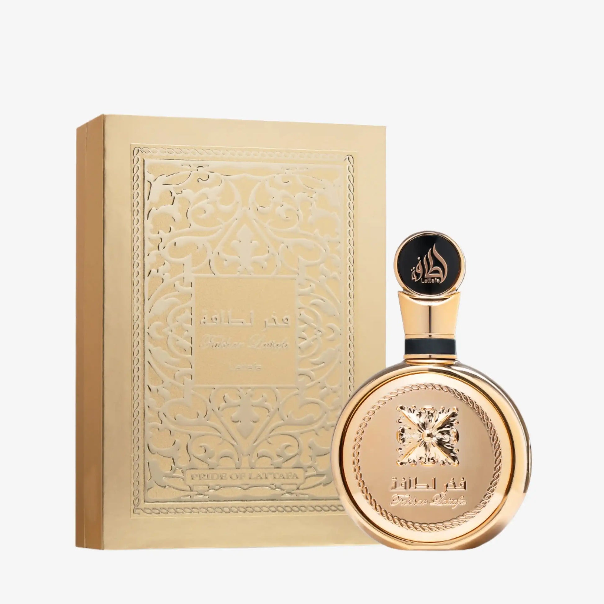 Gold Middle Eastern perfume bottle and ornate gift box with Arabic design
