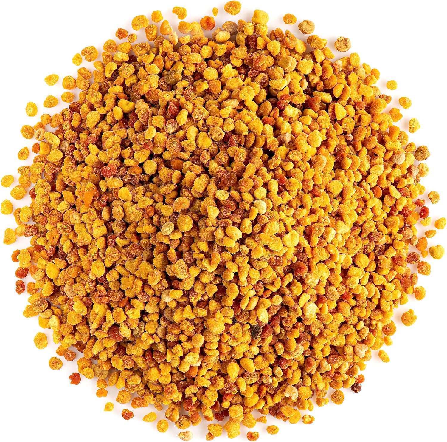 Close-up of golden bee pollen granules on white background, natural healthy superfood