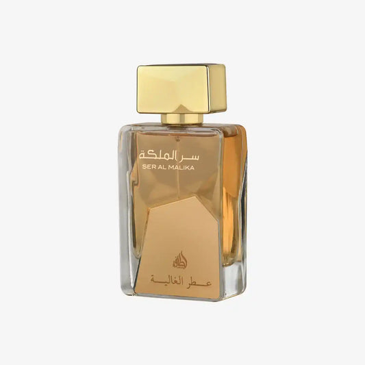 Luxury Middle Eastern perfume bottle with gold cap and Arabic label, clear glass design
