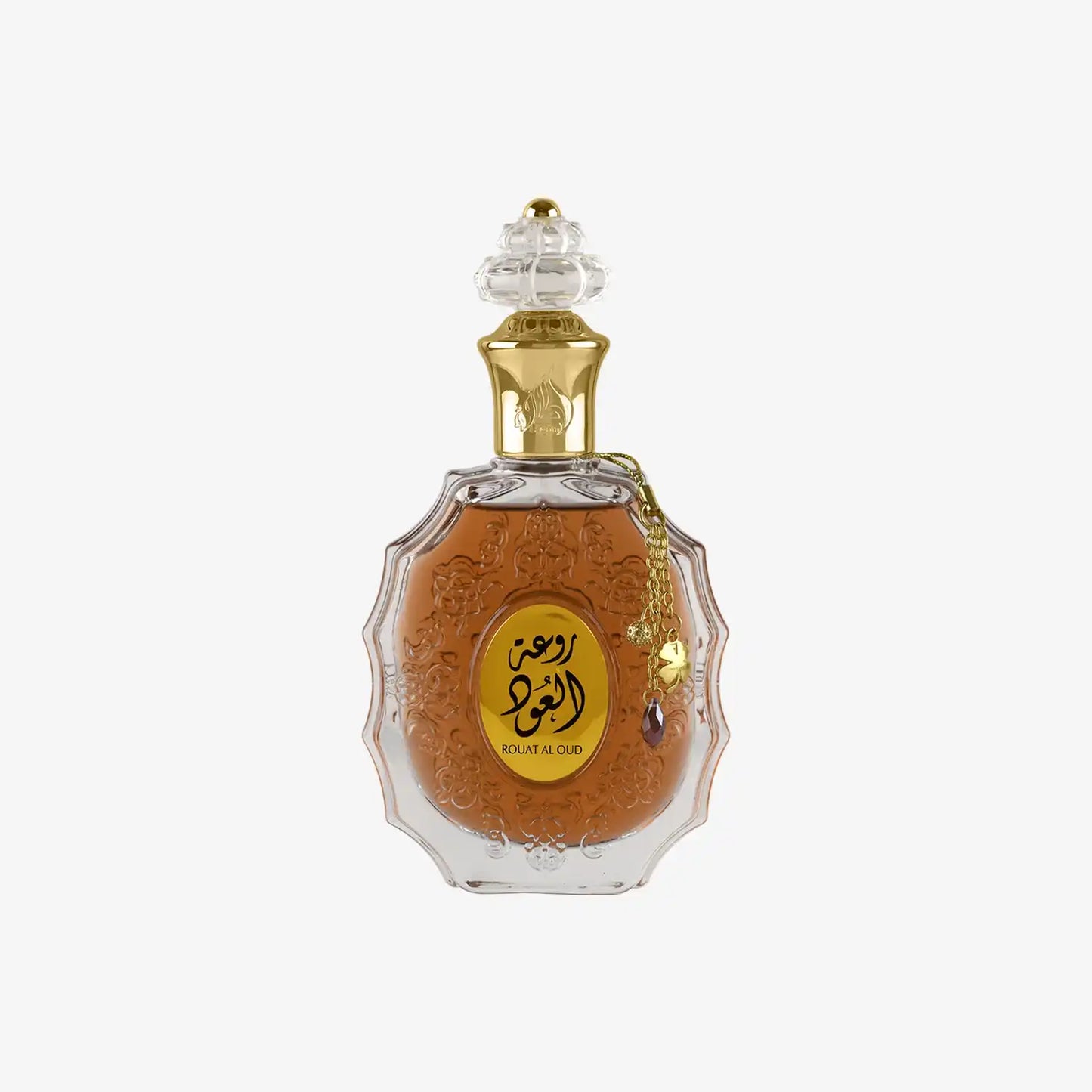 Middle Eastern oud perfume in ornate glass bottle with gold Arabic label and decorative cap