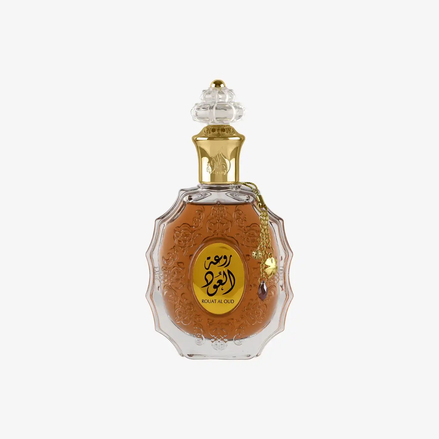 Middle Eastern oud perfume in ornate glass bottle with gold Arabic label and decorative cap