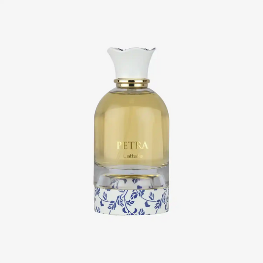 Clear glass PETRA Lattafa perfume bottle with gold accents and floral patterned base