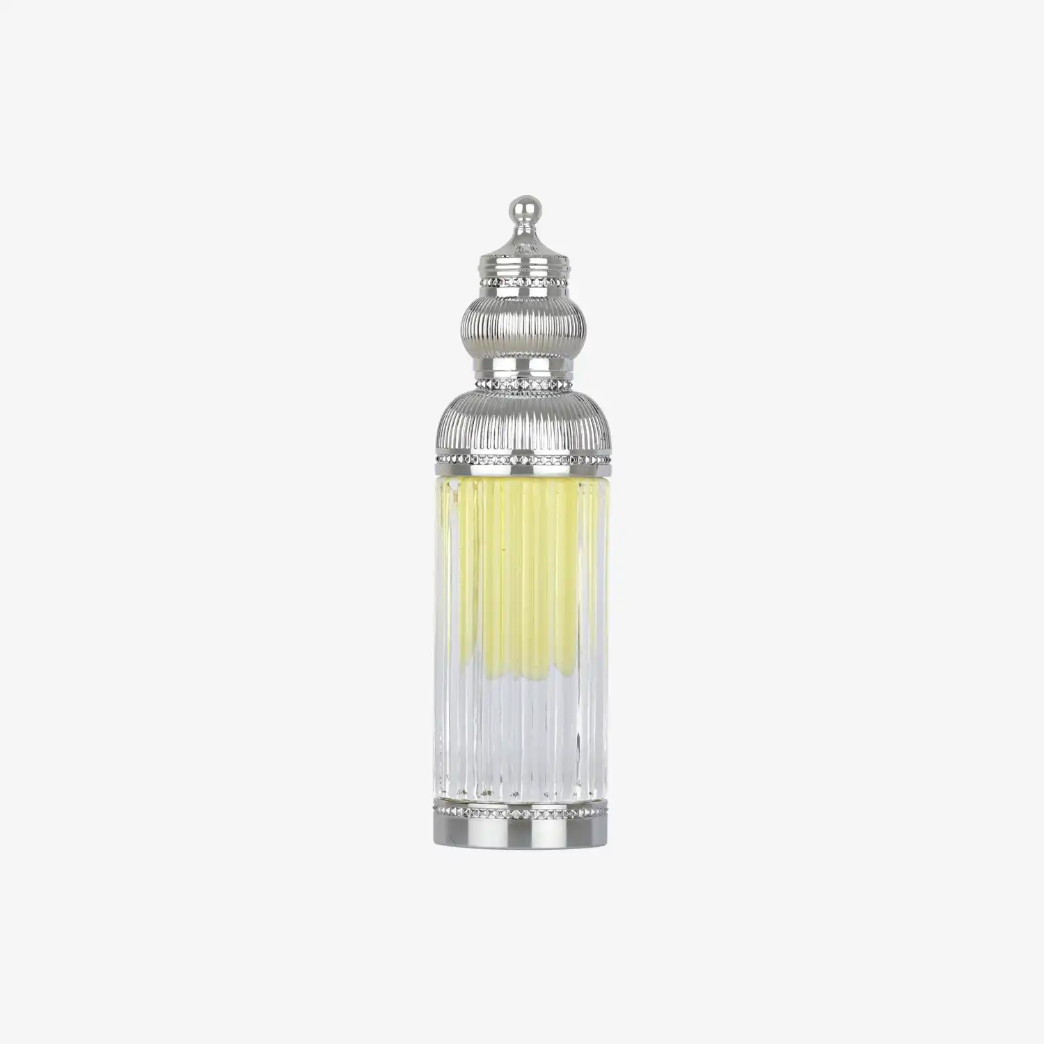 Ornate glass bottle of Middle Eastern oil with silver decorative cap on white background