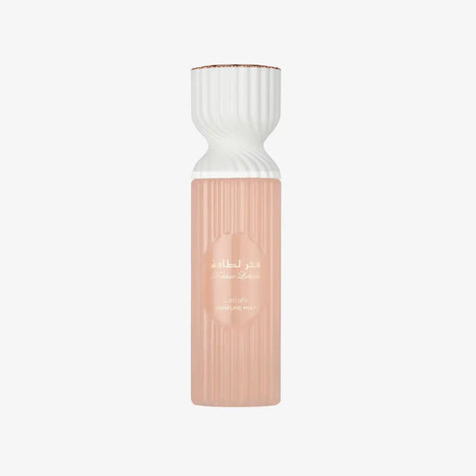 Lattafa perfume mist bottle with Arabic writing and ribbed peach-pink design on white background