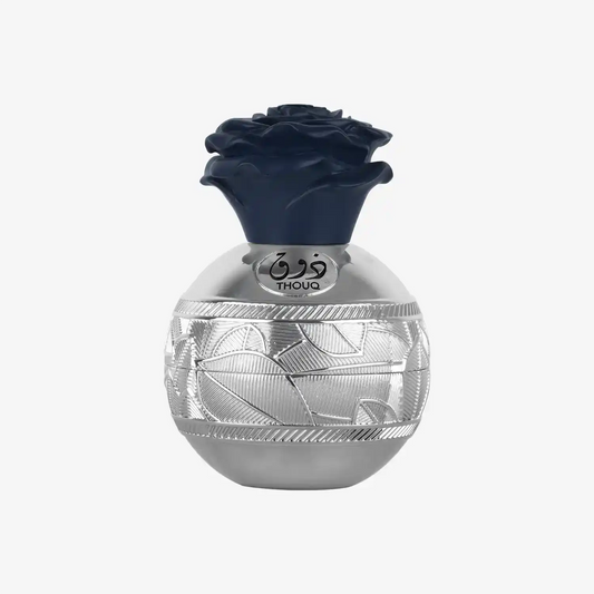 Elegant silver Middle Eastern perfume bottle with intricate pattern and rose-shaped blue cap