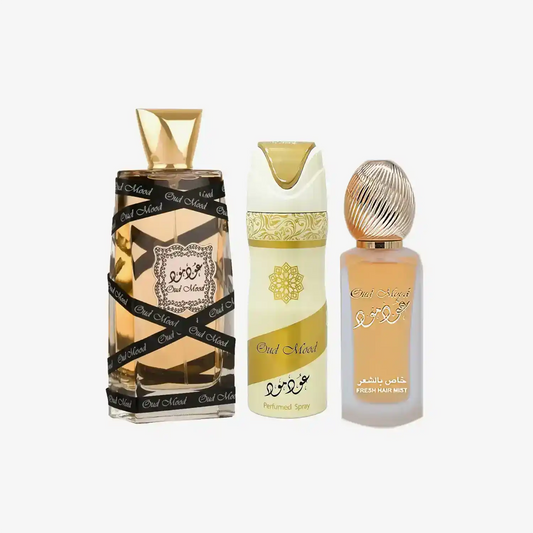 Oud Mood luxury perfume collection with elegant gold and cream bottles, featuring perfumed spray and hair mist.