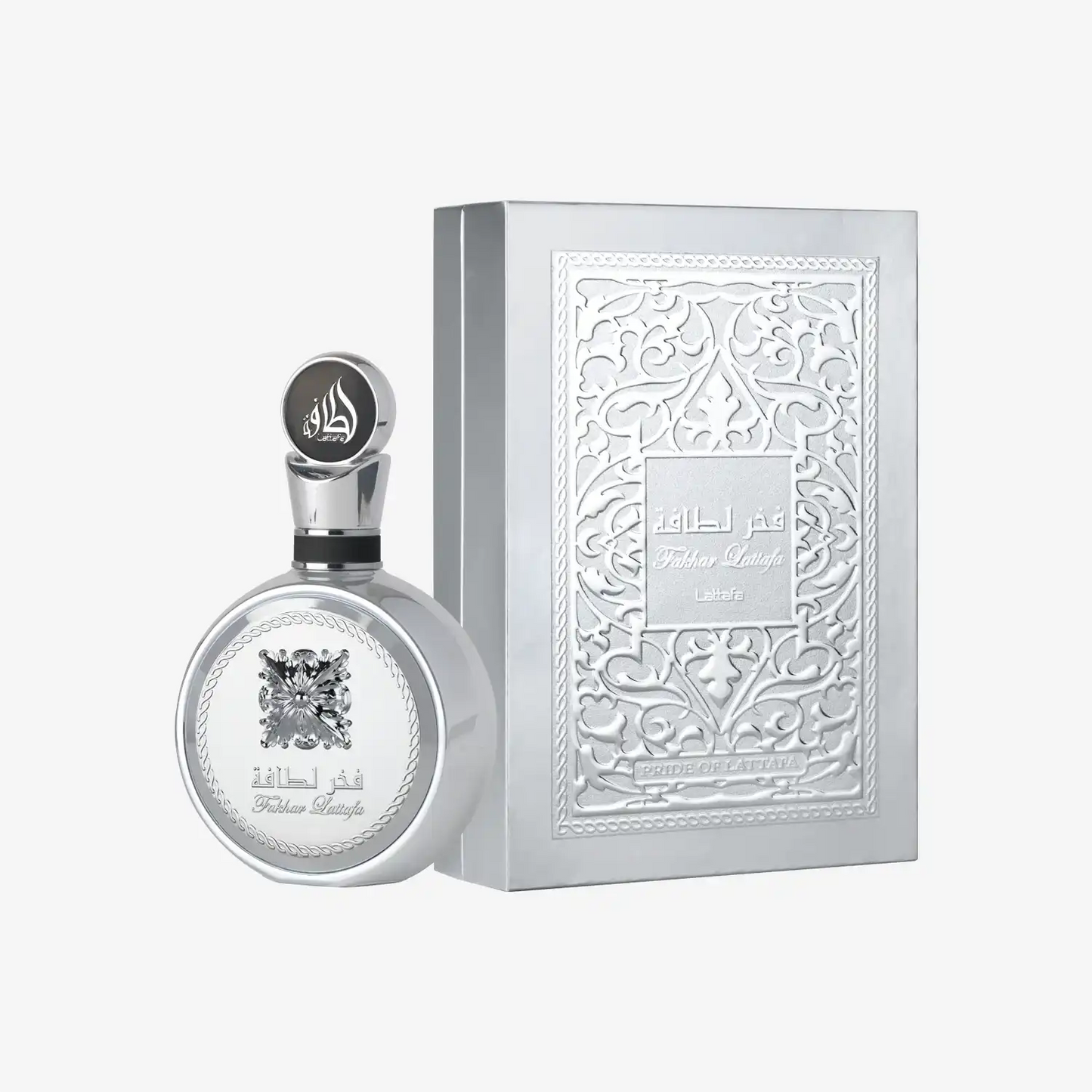 Silver Middle Eastern perfume bottle with ornate embossed box and Arabic script
