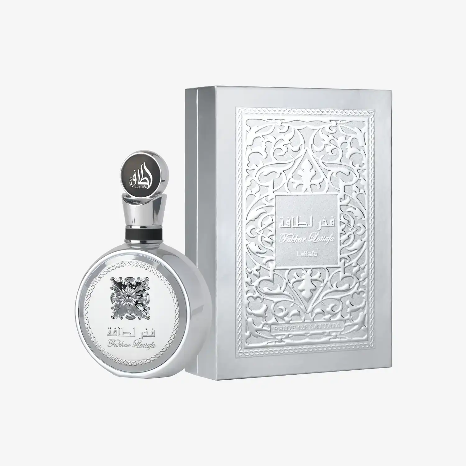 Silver Middle Eastern perfume bottle with ornate embossed box and Arabic script