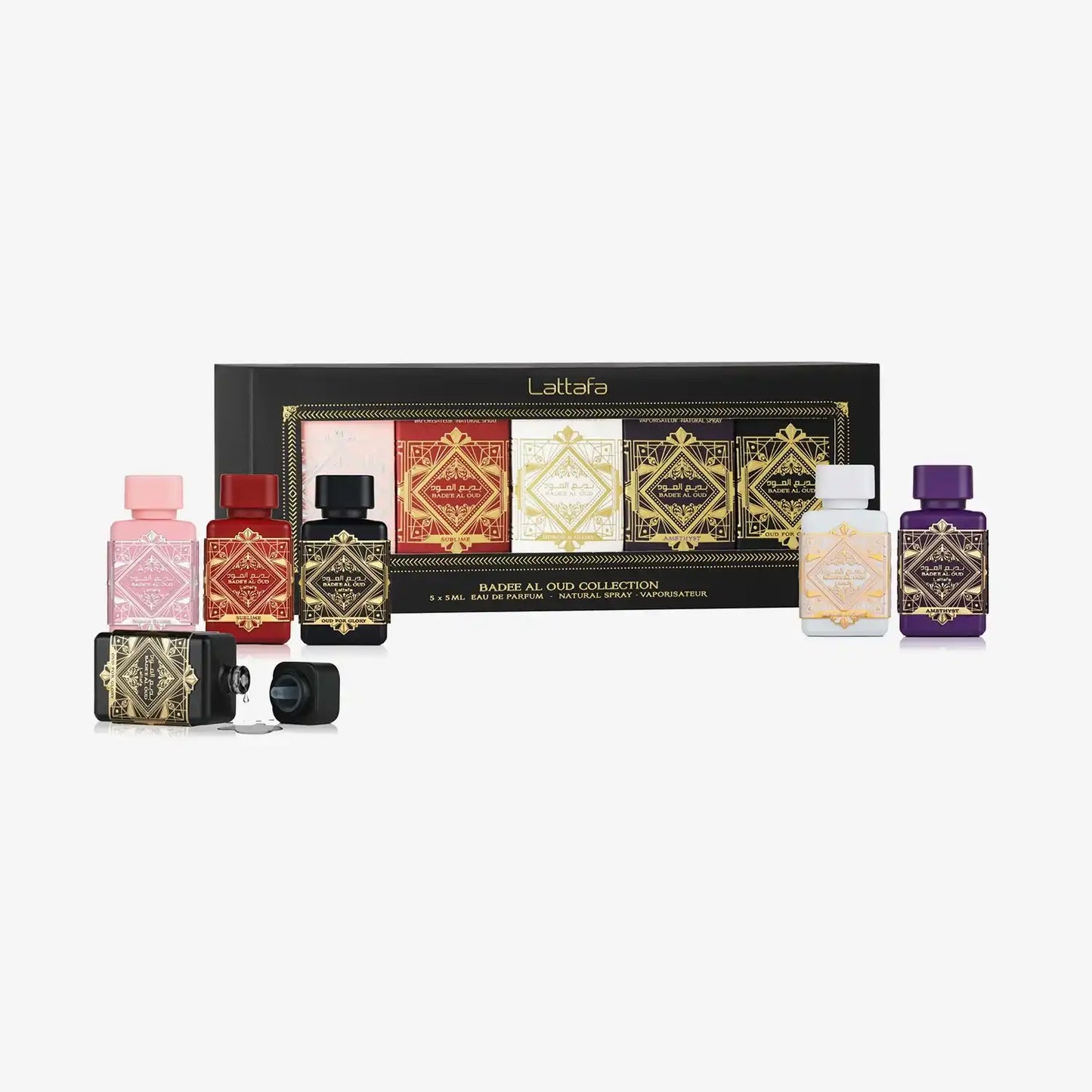 Luxe Middle Eastern perfume set with ornate bottles, oud fragrance collection, gift box display