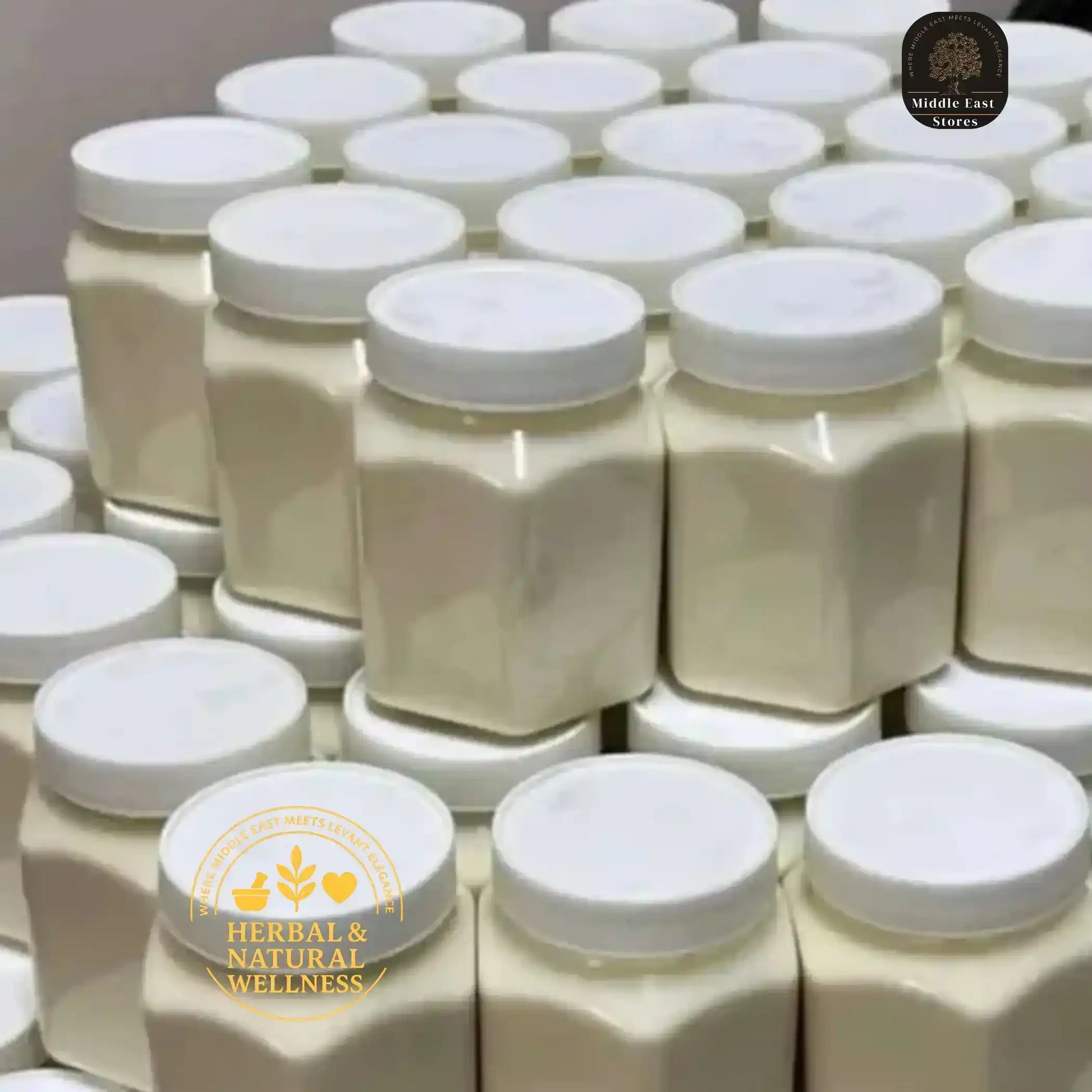 Stacked jars of Middle Eastern tahini with white lids, natural ingredients, bulk packaging