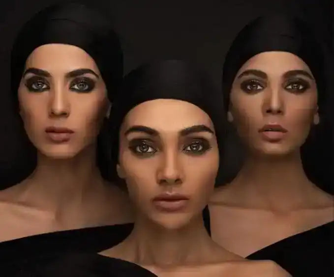 Three women with dramatic smoky eye makeup wearing black head wraps and off-shoulder black tops on dark background