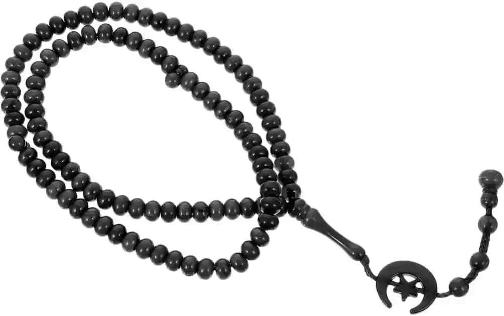 Black beaded tasbih prayer beads with crescent moon and star charm on white background