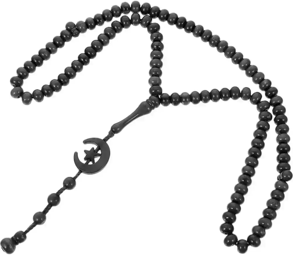 black Islamic prayer beads with crescent moon and star pendant on white background