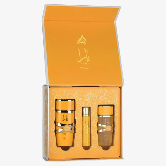 Middle Eastern perfume gift set with three gold bottles in an ornate orange box.