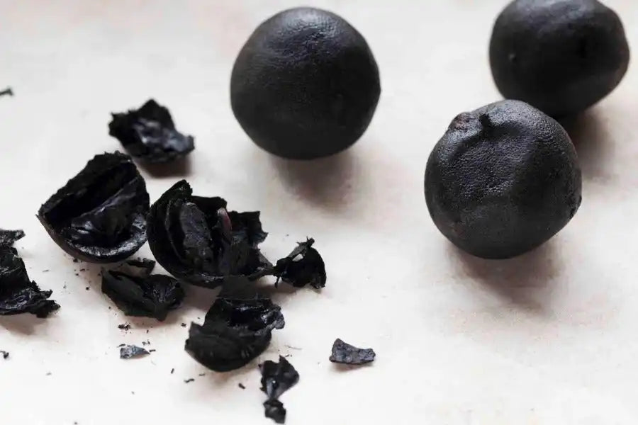 Black lemon, dried Middle Eastern spice with cracked pieces, used in authentic regional cuisine