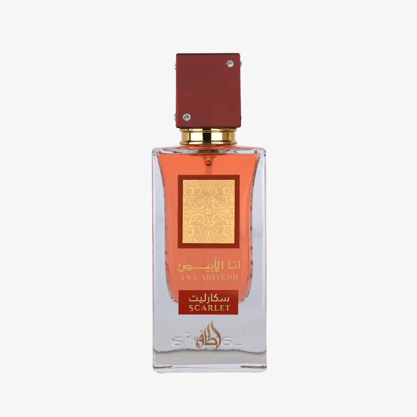 Clear glass perfume bottle with red cap, gold label, and scarlet Arabic and English text.