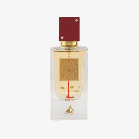 Ana Abiyedh Rouge perfume bottle with red cap, gold accents, and Arabic script on clear glass