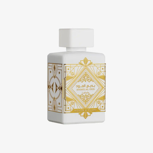 White and gold bottle of Badee Al Oud Honor & Glory perfume with Arabic geometric patterns
