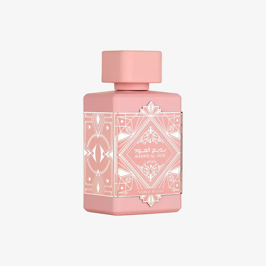 Pink Badee Al Oud Noble Blush perfume bottle with geometric gold pattern and Arabic text