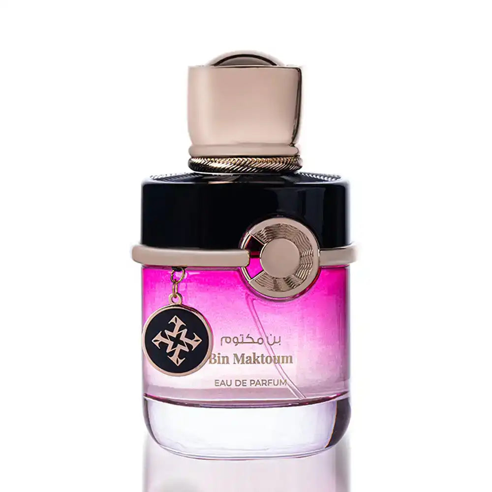 Bin Maktoum Eau de Parfum in pink gradient glass bottle with gold and black cap and charm
