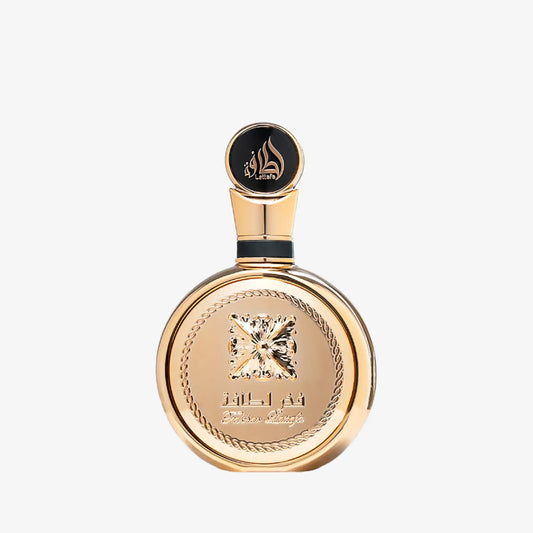 Elegant gold Middle Eastern perfume bottle with embossed design and Arabic calligraphy