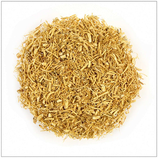 Loose cut dried ginseng root tea herbal blend on a white background