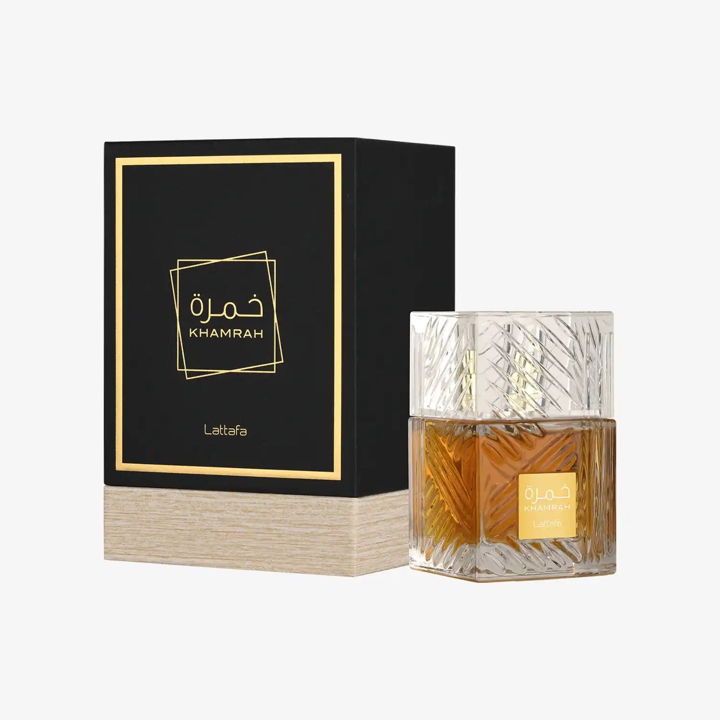 Khamrah Lattafa perfume bottle with textured glass next to black and gold box