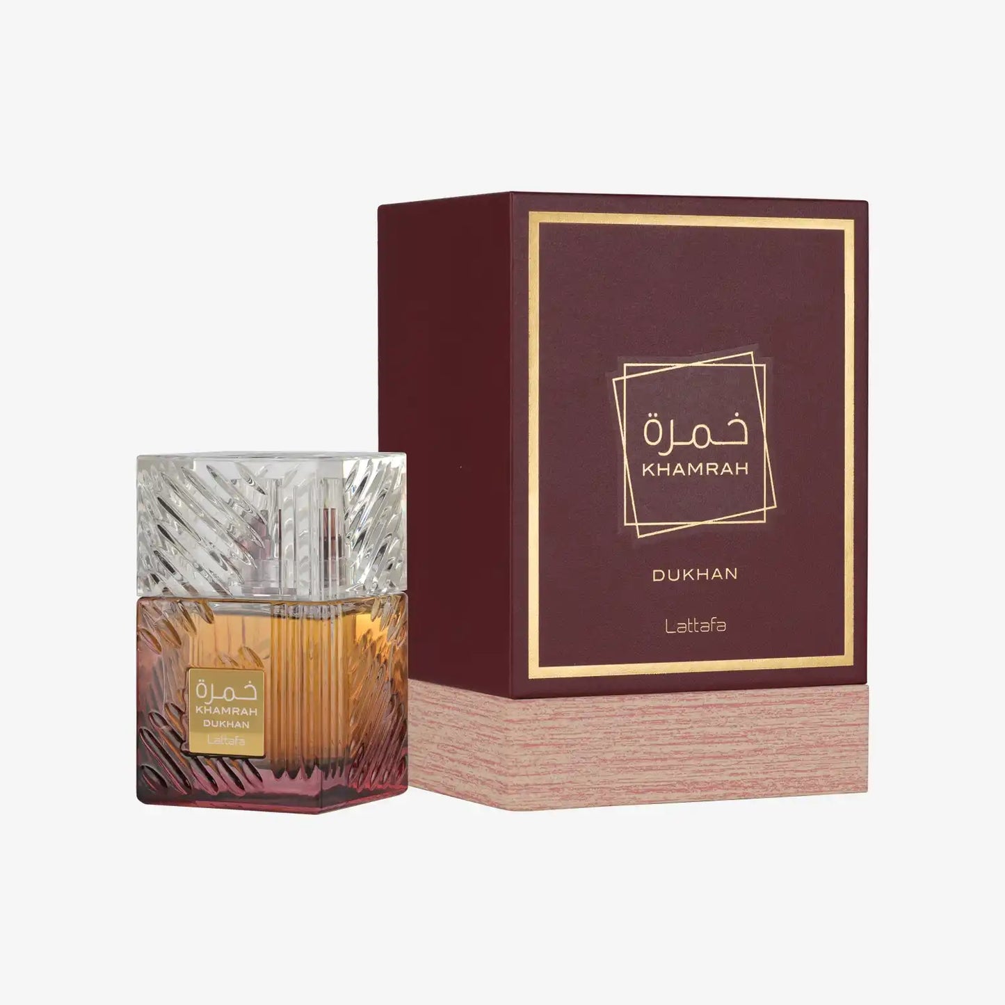Khamrah Dukhan Lattafa perfume bottle with patterned glass and matching maroon box