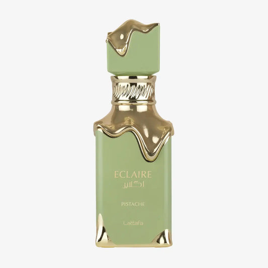 Green and gold Lattafa Eclaire Pistache perfume bottle with metallic accents