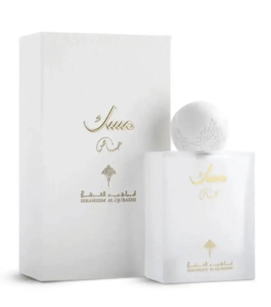 White perfume bottle and packaging with gold text on a white background