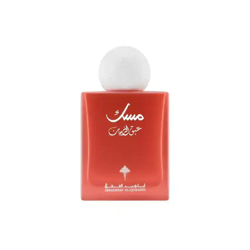 Red bottle of Musc perfume with white cap, Arabic script, and Ibrahim Al Qurashi branding, Middle Eastern fragrance.