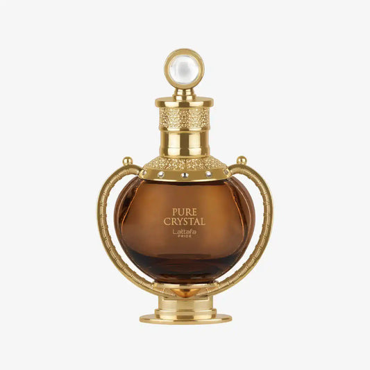 Pure Crystal perfume bottle with ornate gold design and round cap on white background