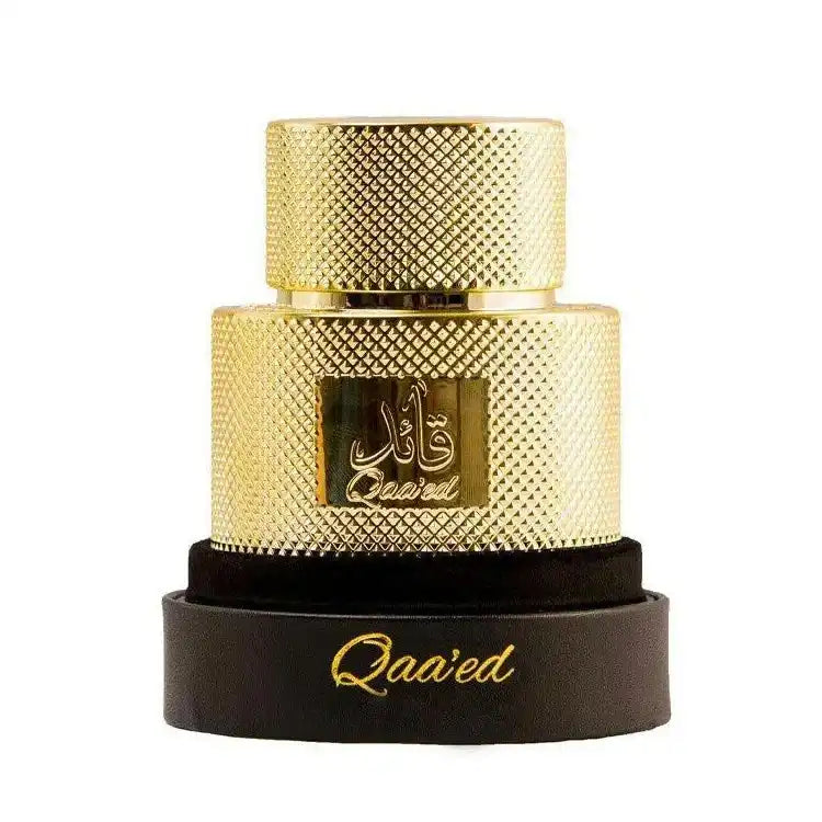 Qaa'ed gold textured perfume bottle on black base, luxury Middle Eastern fragrance