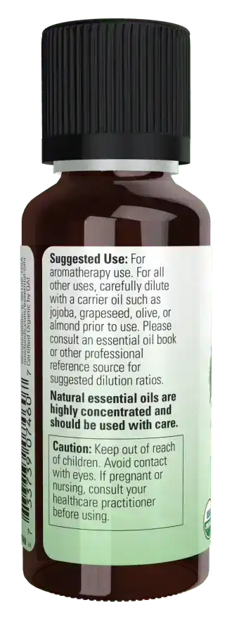 Brown glass bottle of organic rosemary essential oil with black cap and usage instructions label.