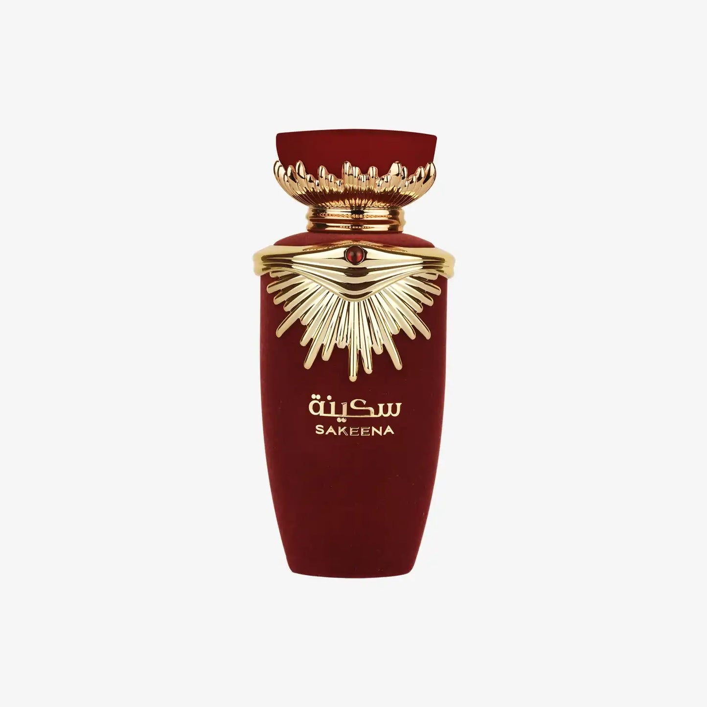 Red and gold Middle Eastern perfume bottle labeled Sakeena with decorative cap