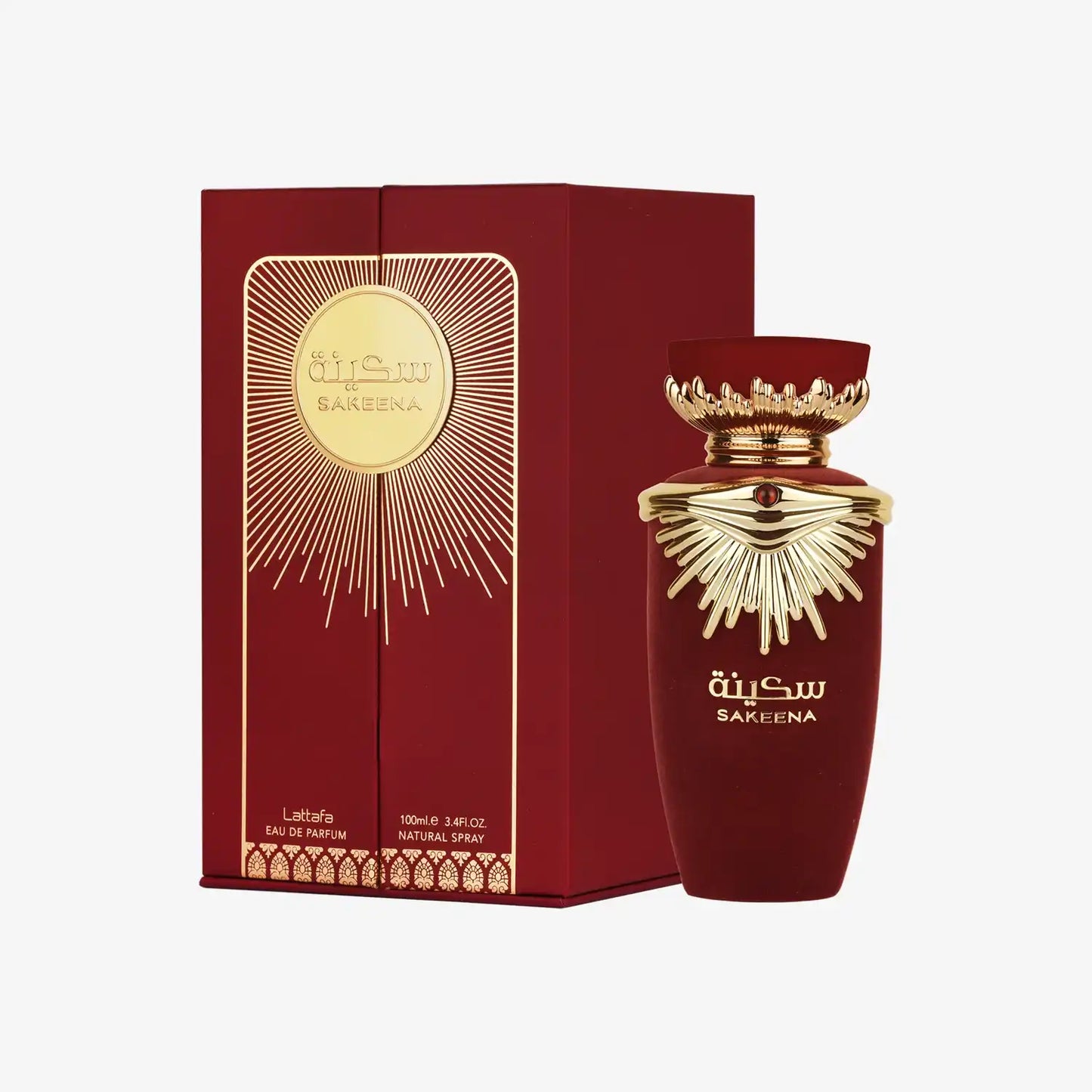 Sakeena perfume bottle and box, deep red with gold Middle Eastern design accents.