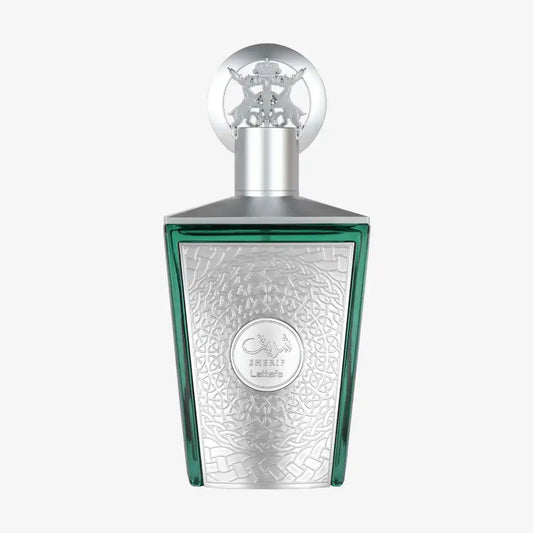 Middle Eastern perfume bottle with intricate silver design and green accents