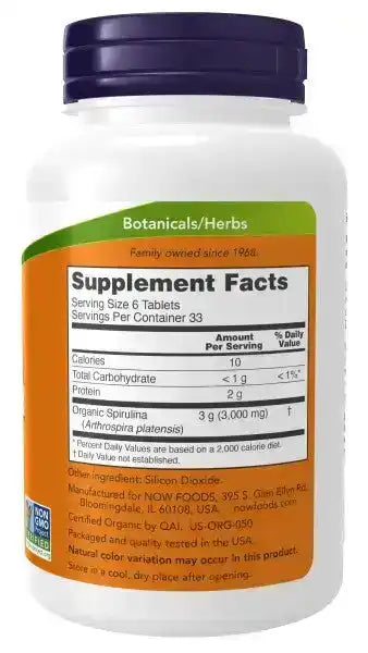Spirulina 500mg supplement bottle with supplement facts and green herb label visible