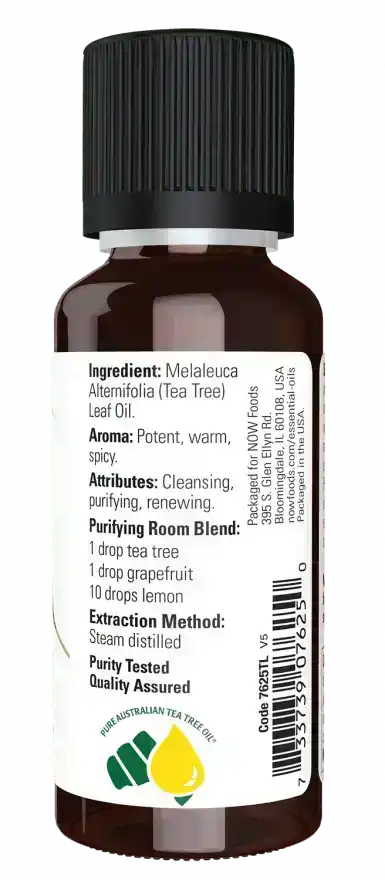 Tea tree essential oil bottle with detailed ingredient and usage label